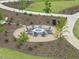 Relax and socialize by the cozy fire pit in this community's common area at 1605 Silo Point Dr, Wake Forest, NC 27587