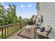 The outdoor deck features seating and a grill, perfect for entertaining guests at 1605 Silo Point Dr, Wake Forest, NC 27587