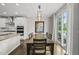 Open dining area with sliding glass doors and hardwood flooring at 1605 Silo Point Dr, Wake Forest, NC 27587