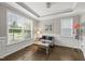 Elegant living room with tray ceilings, hardwood floors, and bright natural lighting at 1605 Silo Point Dr, Wake Forest, NC 27587