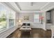 Elegant living room with tray ceilings, hardwood floors, and bright natural lighting at 1605 Silo Point Dr, Wake Forest, NC 27587