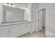 Bathroom showcasing a granite counter top on the double sink vanity and a closet at 1665 Wilde Bnd, Apex, NC 27523