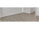 A bedroom featuring hardwood floors, lots of natural light, and neutral paint at 1665 Wilde Bnd, Apex, NC 27523