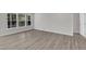 A bedroom featuring hardwood floors, lots of natural light, and neutral paint at 1665 Wilde Bnd, Apex, NC 27523