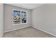 Bedroom showcasing carpeted floors and large windows at 1665 Wilde Bnd, Apex, NC 27523
