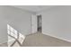 Bedroom with a neutral paint scheme, carpet, and a large closet at 1665 Wilde Bnd, Apex, NC 27523