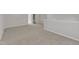 Open bonus room featuring neutral carpet, a large doorway and neutral paint at 1665 Wilde Bnd, Apex, NC 27523