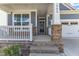 Inviting front porch with stone accents on the support beams leading to the home's entryway at 1665 Wilde Bnd, Apex, NC 27523