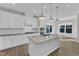 Bright kitchen featuring stainless steel appliances, a center island and ample storage space in the cabinets at 1665 Wilde Bnd, Apex, NC 27523