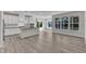A kitchen featuring a large island, stainless steel appliances, and hardwood floors at 1665 Wilde Bnd, Apex, NC 27523
