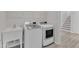 Laundry room with side by side washer and dryer, a utility sink and stairs at 1665 Wilde Bnd, Apex, NC 27523