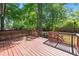 Spacious wooden deck overlooking a private, fenced backyard surrounded by lush greenery, perfect for outdoor enjoyment at 1700 Laura Duncan Rd, Apex, NC 27502