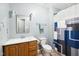 Well-maintained bathroom featuring a vanity, mirror, and shower with a neutral color palette, providing a clean aesthetic at 1700 Laura Duncan Rd, Apex, NC 27502