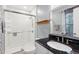 Updated bathroom with a glass-enclosed shower, granite countertop, and modern fixtures at 1700 Laura Duncan Rd, Apex, NC 27502