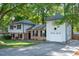 Charming two-story home featuring brick accents, light siding, attached garage and a well-maintained lawn at 1700 Laura Duncan Rd, Apex, NC 27502