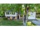 Charming two-story home with a well-manicured lawn and mature trees at 1700 Laura Duncan Rd, Apex, NC 27502