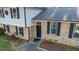 Attractive home with brick facade, black shutters, well-kept landscaping and a black front door at 1700 Laura Duncan Rd, Apex, NC 27502