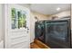 Modern laundry room with new washer and dryer, plus easy access to the outdoors at 1700 Laura Duncan Rd, Apex, NC 27502