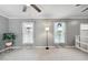 Spacious living room filled with natural light, neutral walls and plush carpeting at 1700 Laura Duncan Rd, Apex, NC 27502