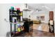 Living space with kitchenette, stainless hood, tile floors and bedroom area at 1700 Laura Duncan Rd, Apex, NC 27502