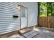 Side entrance of home, showing door, mailbox, and fenced area at 1700 Laura Duncan Rd, Apex, NC 27502