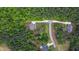 Aerial view of a home showing the circular driveway, landscaping and surrounding trees at 197 Boxwood Dr, Pittsboro, NC 27312