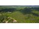 Aerial view of a home located in a neighborhood with beautiful treed landscapes and a nearby lake at 197 Boxwood Dr, Pittsboro, NC 27312
