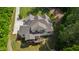 Aerial view showcasing the architectural roof lines, lush lawn and outdoor fireplace at 197 Boxwood Dr, Pittsboro, NC 27312