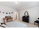 Comfortable bedroom features a neutral palette and hardwood desk at 197 Boxwood Dr, Pittsboro, NC 27312