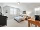 Charming bedroom boasts natural light and neutral carpet at 197 Boxwood Dr, Pittsboro, NC 27312