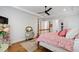Cozy bedroom features hardwood floors, decorative dressers, and a four-poster bed at 197 Boxwood Dr, Pittsboro, NC 27312