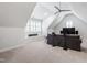 Bright, spacious bonus room features a neutral carpet, white trim and built in shelves at 197 Boxwood Dr, Pittsboro, NC 27312