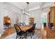 Charming dining room featuring a farmhouse table, coffered ceilings, and classic decor at 197 Boxwood Dr, Pittsboro, NC 27312