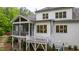 Exterior view of a home featuring a screened porch, back deck and manicured landscaping at 197 Boxwood Dr, Pittsboro, NC 27312