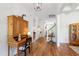 Spacious foyer with gleaming hardwood floors, a vintage desk, and views into the home's inviting living spaces at 197 Boxwood Dr, Pittsboro, NC 27312