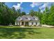 Charming two-story home with landscaped front yard and walkway to a covered porch at 197 Boxwood Dr, Pittsboro, NC 27312