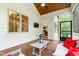 Cozy screened porch featuring a ceiling fan, wood floors and outdoor furniture at 197 Boxwood Dr, Pittsboro, NC 27312