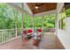 Relaxing screened porch with vaulted ceiling and comfortable seating overlooking the backyard at 197 Boxwood Dr, Pittsboro, NC 27312