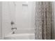 Fresh bathroom with a white tub, shower with a patterned curtain, and subway tile at 197 Boxwood Dr, Pittsboro, NC 27312