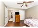 This bedroom offers ample closet space, a fan and an ensuite at 198 Fore View Ln, Sanford, NC 27332