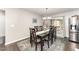 Dining room features hardwood floors, a chandelier, and sliding glass doors to back patio at 198 Fore View Ln, Sanford, NC 27332