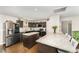 Modern kitchen boasts an island with seating, dark cabinets, and stainless steel appliances at 198 Fore View Ln, Sanford, NC 27332