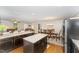 A bright open-concept kitchen with modern appliances and a view to the living and dining areas at 198 Fore View Ln, Sanford, NC 27332