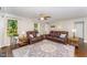 Cozy living room features hardwood floors, neutral walls, ceiling fan, and ample natural light at 198 Fore View Ln, Sanford, NC 27332