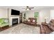 Cozy living room with a fireplace, hardwood floors, neutral walls, and lots of natural light at 198 Fore View Ln, Sanford, NC 27332