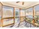 Relaxing screened porch with ceiling fan and comfortable seating area, perfect for enjoying the outdoors at 198 Fore View Ln, Sanford, NC 27332