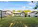 Wide shot of the backyard showing green space and neighborhood homes at 204 Heck St, Raleigh, NC 27601