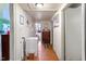 Hallway with artwork and a freezer, connecting to other rooms, offers storage and character at 204 Heck St, Raleigh, NC 27601