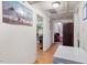 Hallway featuring unique artwork and access to other rooms, enhancing the home's layout at 204 Heck St, Raleigh, NC 27601