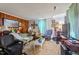 Cozy living room with wood paneling and comfortable seating, awaiting your personal touch at 204 Heck St, Raleigh, NC 27601
